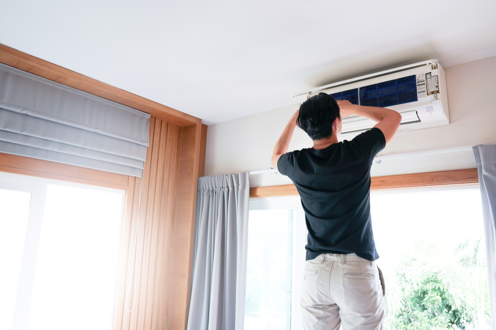 Person Repairing an HVAC Unit