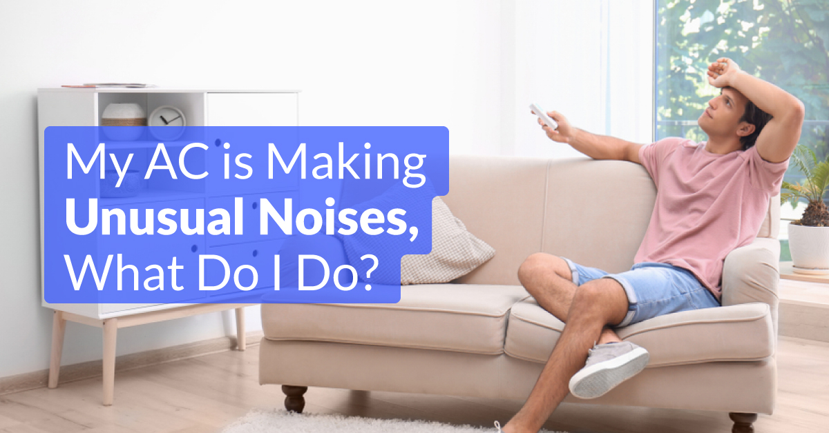 Man Holding AC Remote While Looking at the AC